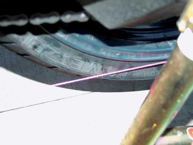 Check motorcycle alignment with string 5