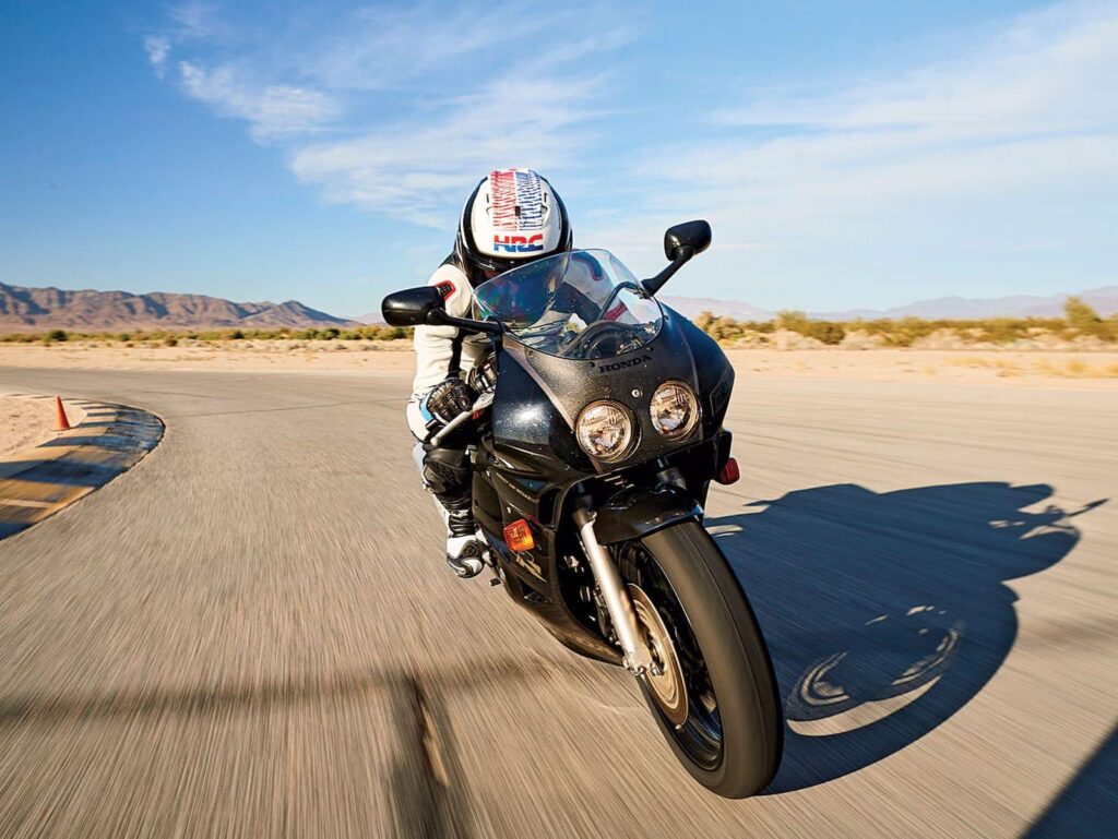 Honda MC22 black CBR250RR on a track