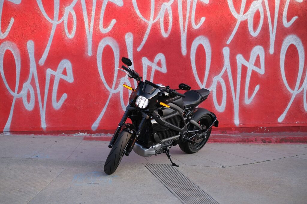 The Harley Davidson LiveWire motorcycle in front of the "love" wall in Los Angeles