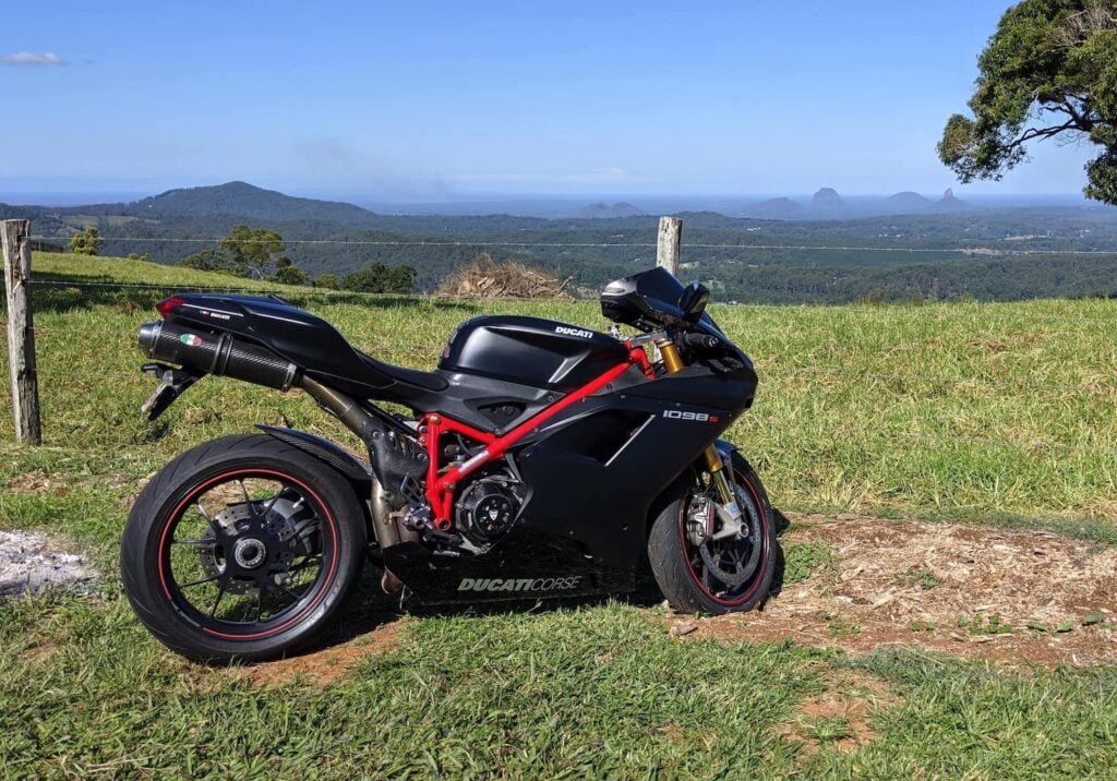 Side view of Ducati 1098S riding into mountains in Australia