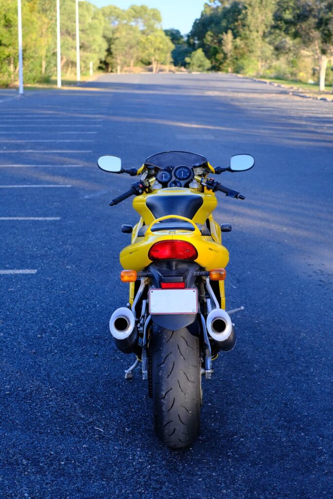 Yellow Ducati Supersport 900 fuel injected from the rear