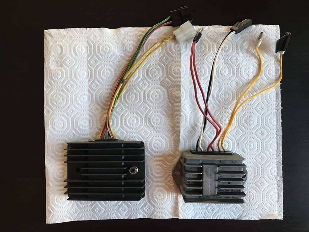 Two regulator/rectifier units from the charging system of two motorcycles