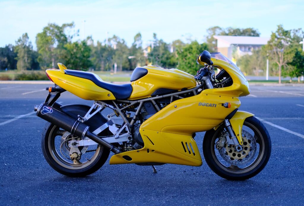 Photo of my Ducati 900SS in front of clean background to demonstrate motorcycle photography