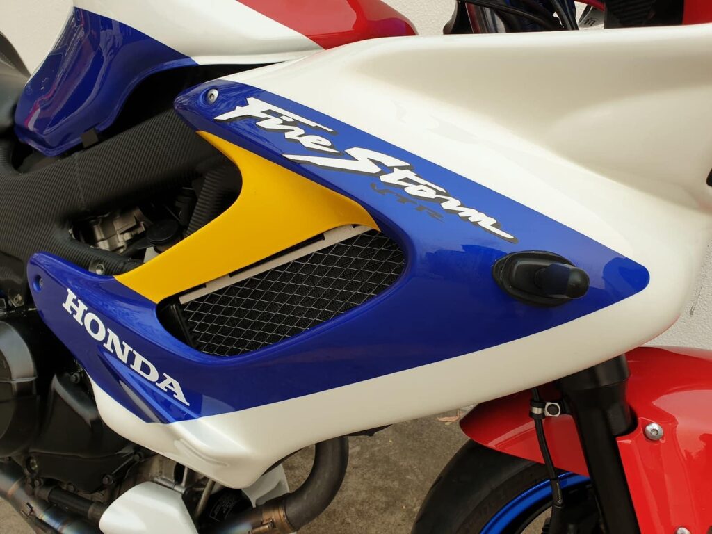 Custom Painted Honda VTR1000F Firestorm in blue, yellow, white, and red - fairings