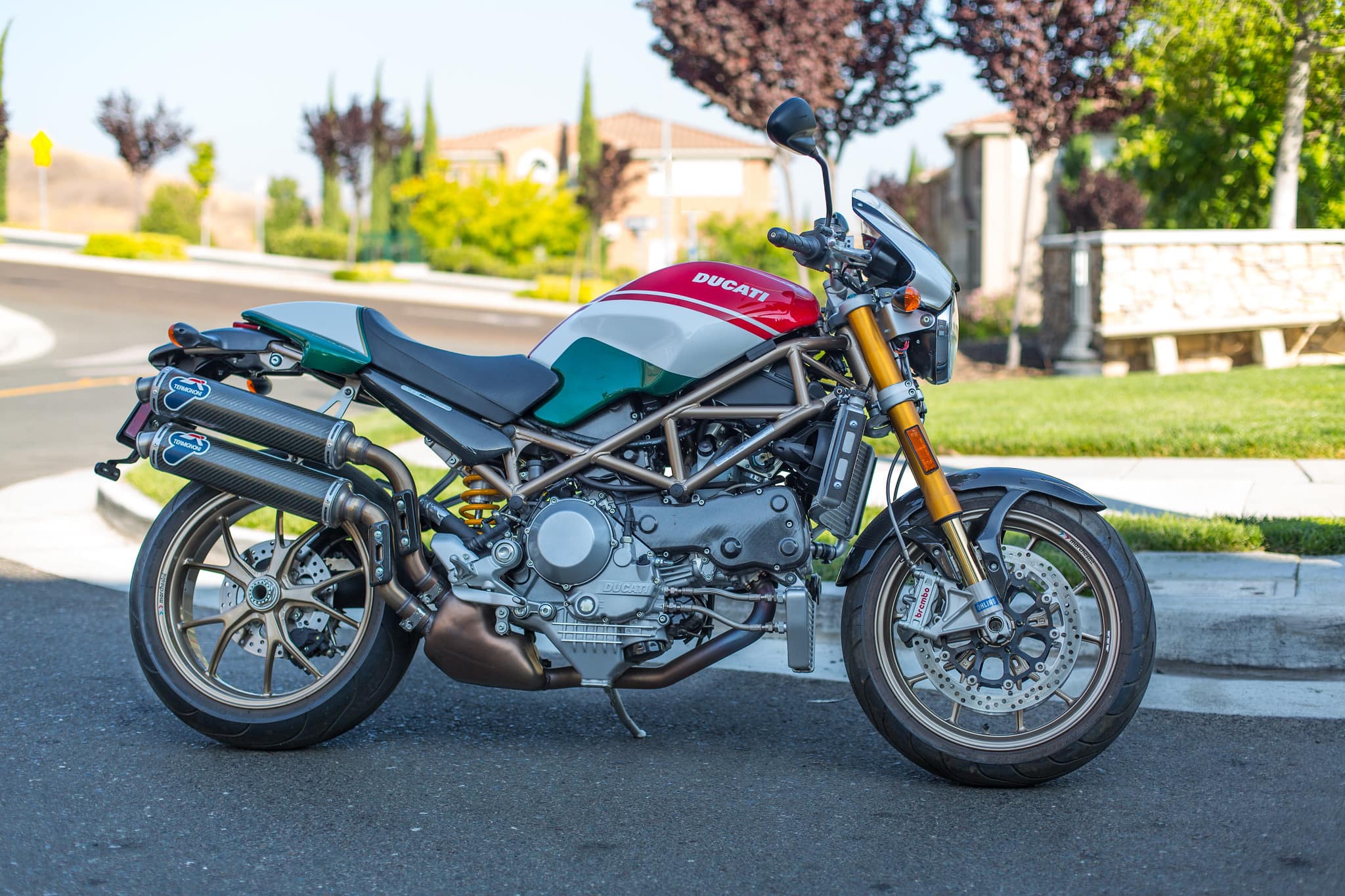 Ducati Monster buyers guide cover image, right hand side of ducati monster s4rs testastretta in red green and white