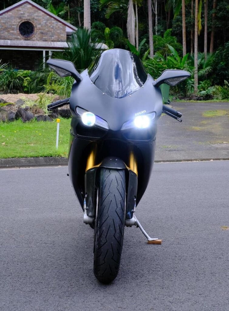 Ducati 1098s with headlights on, including high-beam