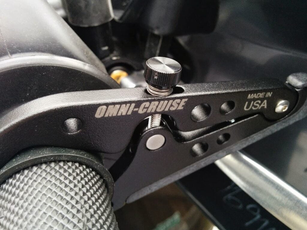 Omni Cruise cruise control installed on a motorcycle handlebar
