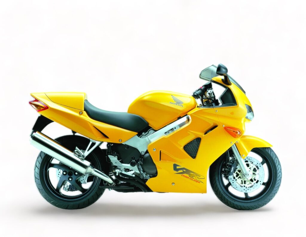 Yellow Honda VFR800 5th gen, right hand side studio image