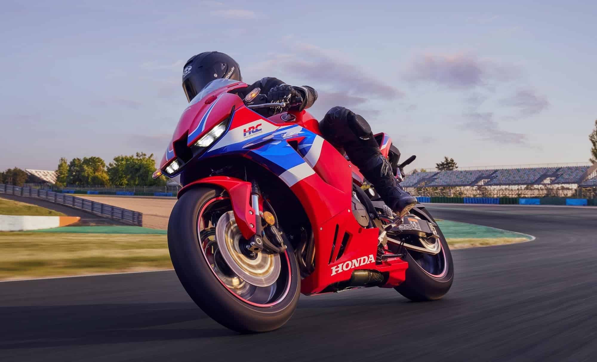 Honda CBR600RR — The Complete Buyer's Guide (2003-2026) 12 2024 Honda CBR600RR in HRC tricolour leaning on a racetrack