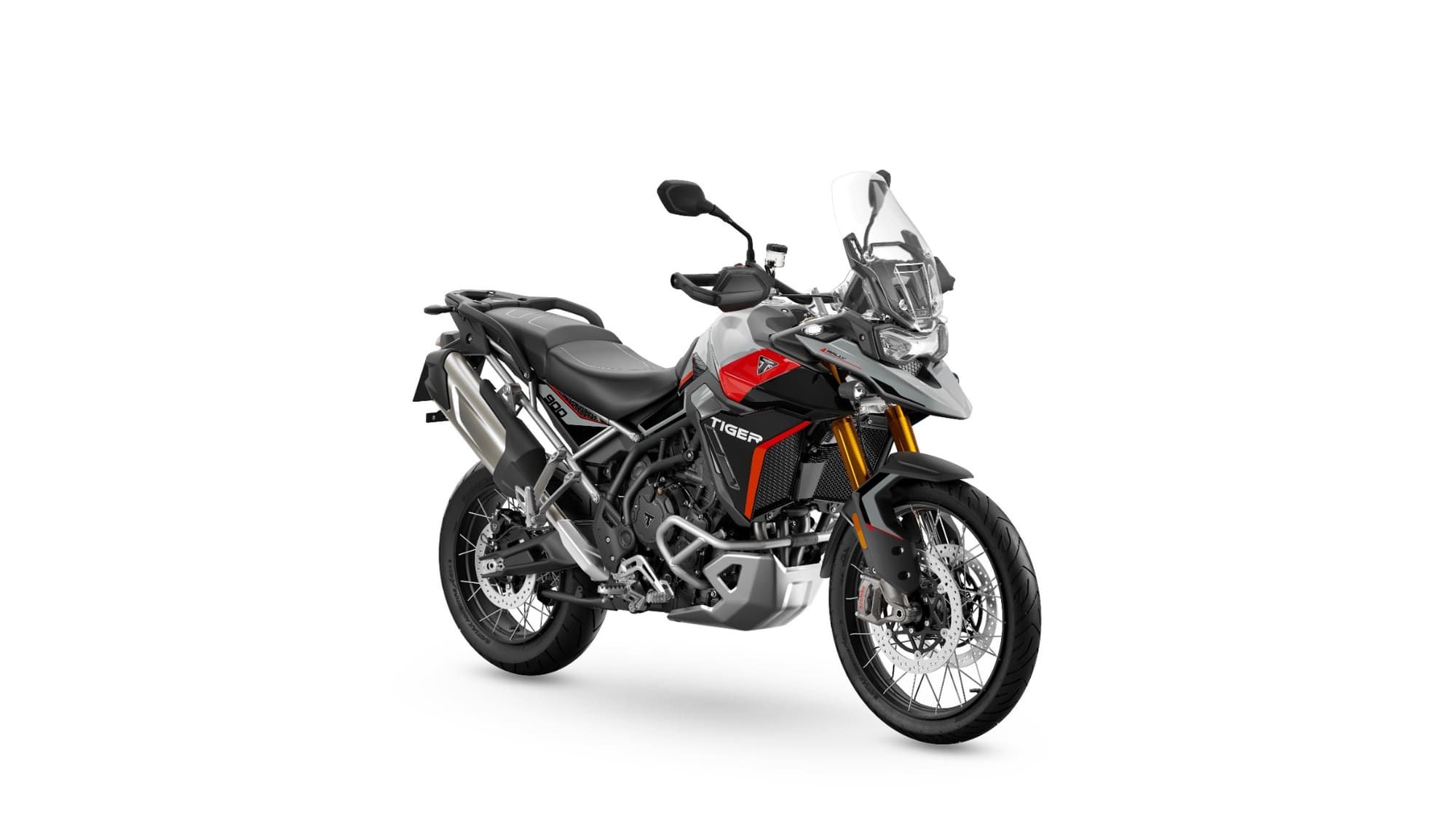 All the Middleweight Adventure Motorcycles — Complete 2026 Comparison 14 2024 Triumph Tiger 900 Rally Pro in Ash Grey, right-front three-quarter studio view