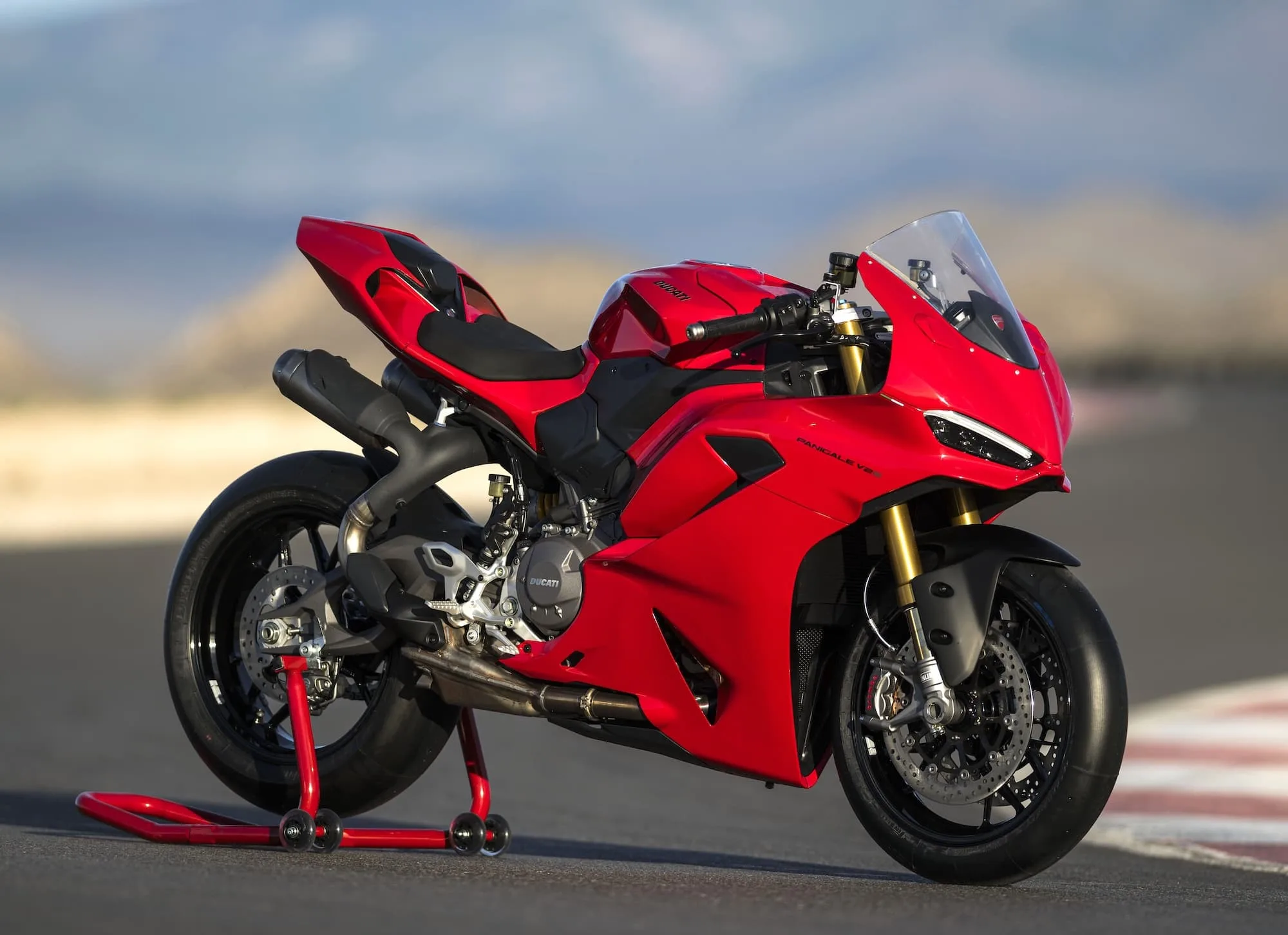 Suzuki GSX-R1000R Review & Buyer’s Guide (2017–2027) 26 2025 Ducati Panigale V2 S in Ducati Red on a race track