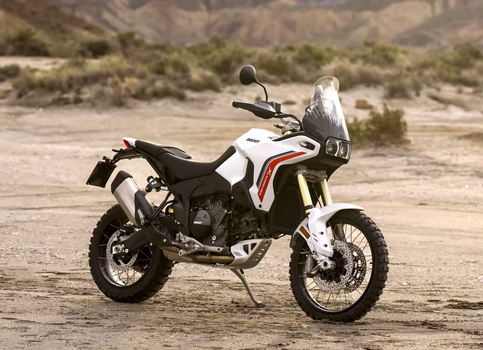 Ducati DesertX Buyer's Guide 1 2026 Ducati DesertX V2 parked in a rocky desert, right-front view