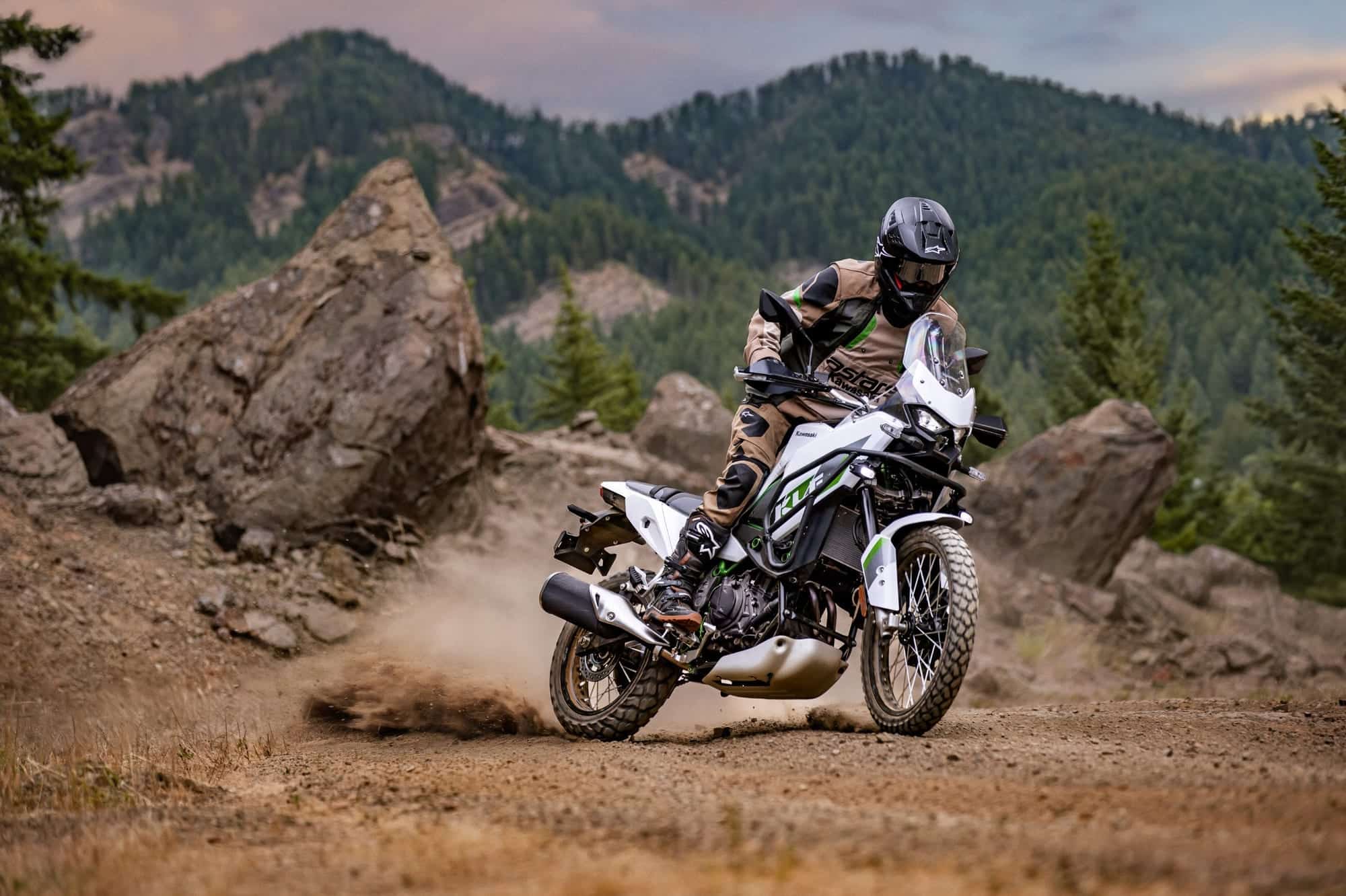 2026 Kawasaki KLE500 Review — Old Name, Better Timing 16 2026 Kawasaki KLE500 SE ridden around a loose gravel corner in mountain terrain