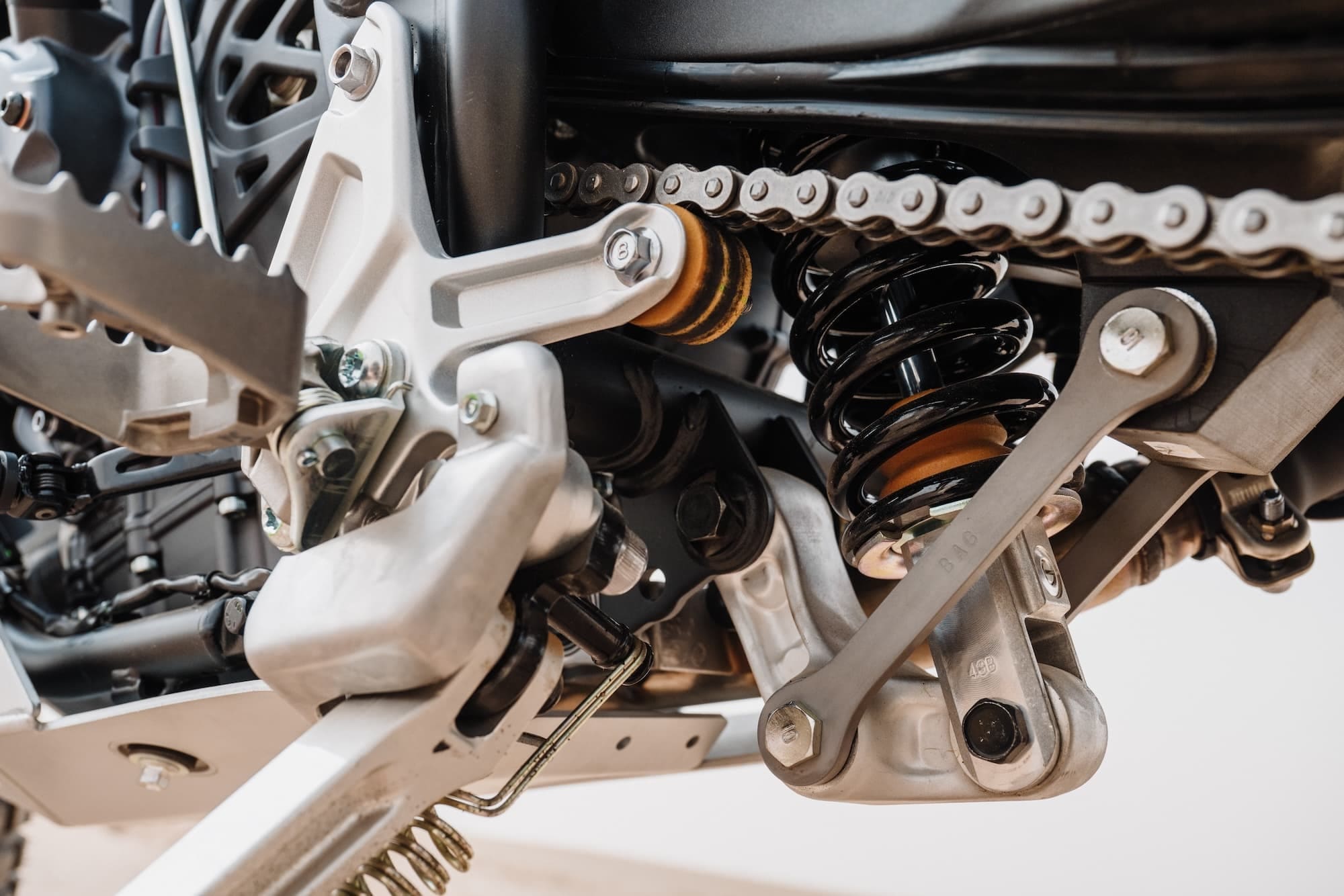 Yamaha Ténéré 700 Model Variants / Buyer’s Guide 2019-2026 17 2026 Yamaha Ténéré 700 Rally rear suspension and chain detail