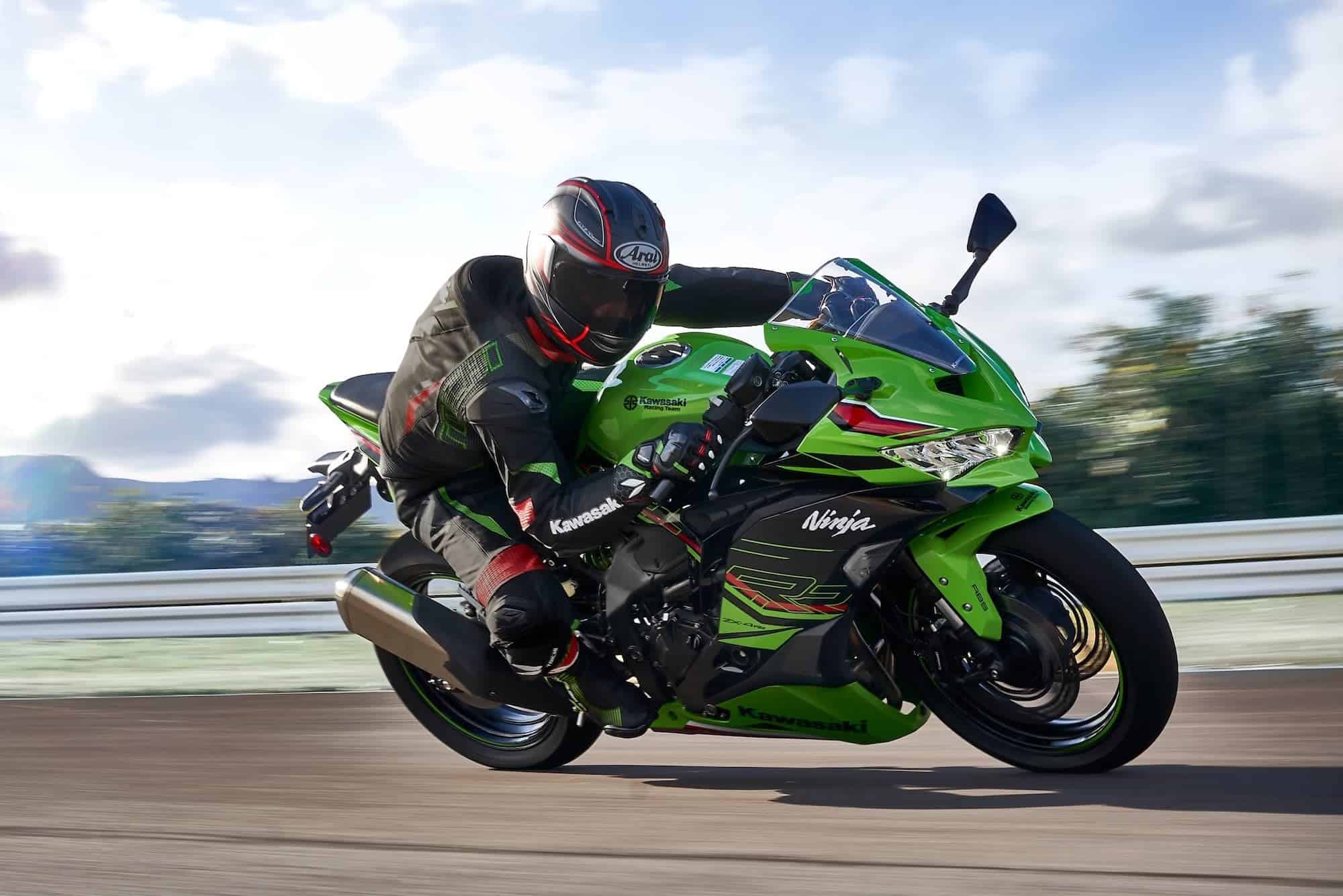 Kawasaki Ninja ZX-4R / ZX-4RR Review — The Return of the Heyday of Small Fours 10 Rider cornering a Kawasaki Ninja ZX-4RR