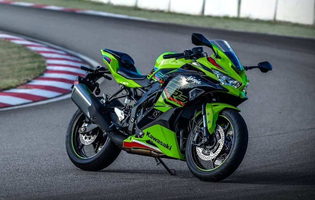 Kawasaki Ninja ZX-4R / ZX-4RR Review — The Return of the Heyday of Small Fours 1 Kawasaki Ninja ZX-4RR parked beside a racetrack corner