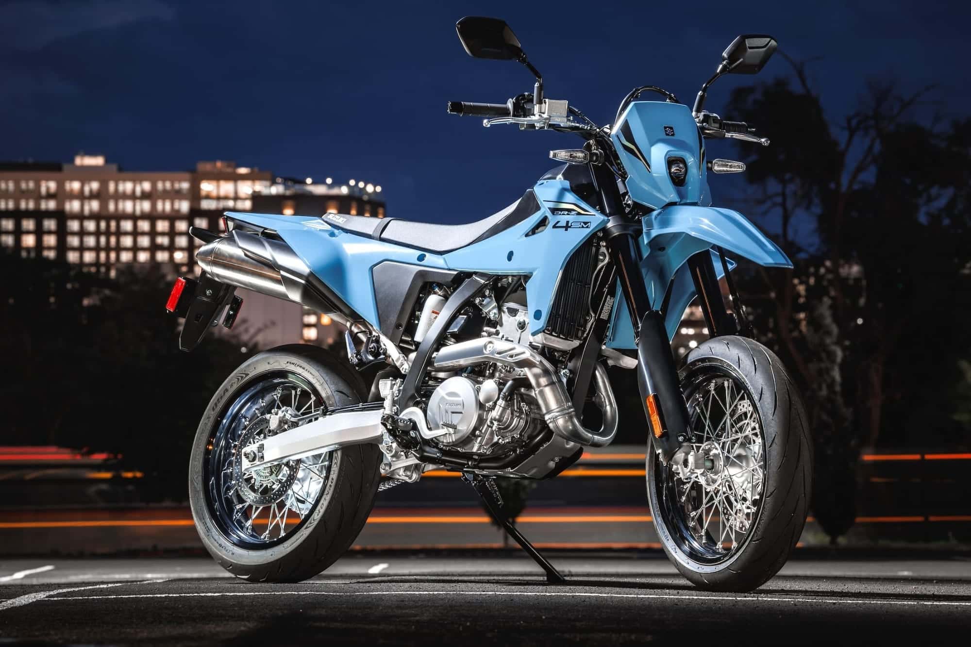 Suzuki DR-Z4S and DR-Z4SM Buyer’s Guide — Somewhat Modern, Still a DR-Z 1 2025 Suzuki DR-Z4SM in Sky Gray, right-front three-quarter view