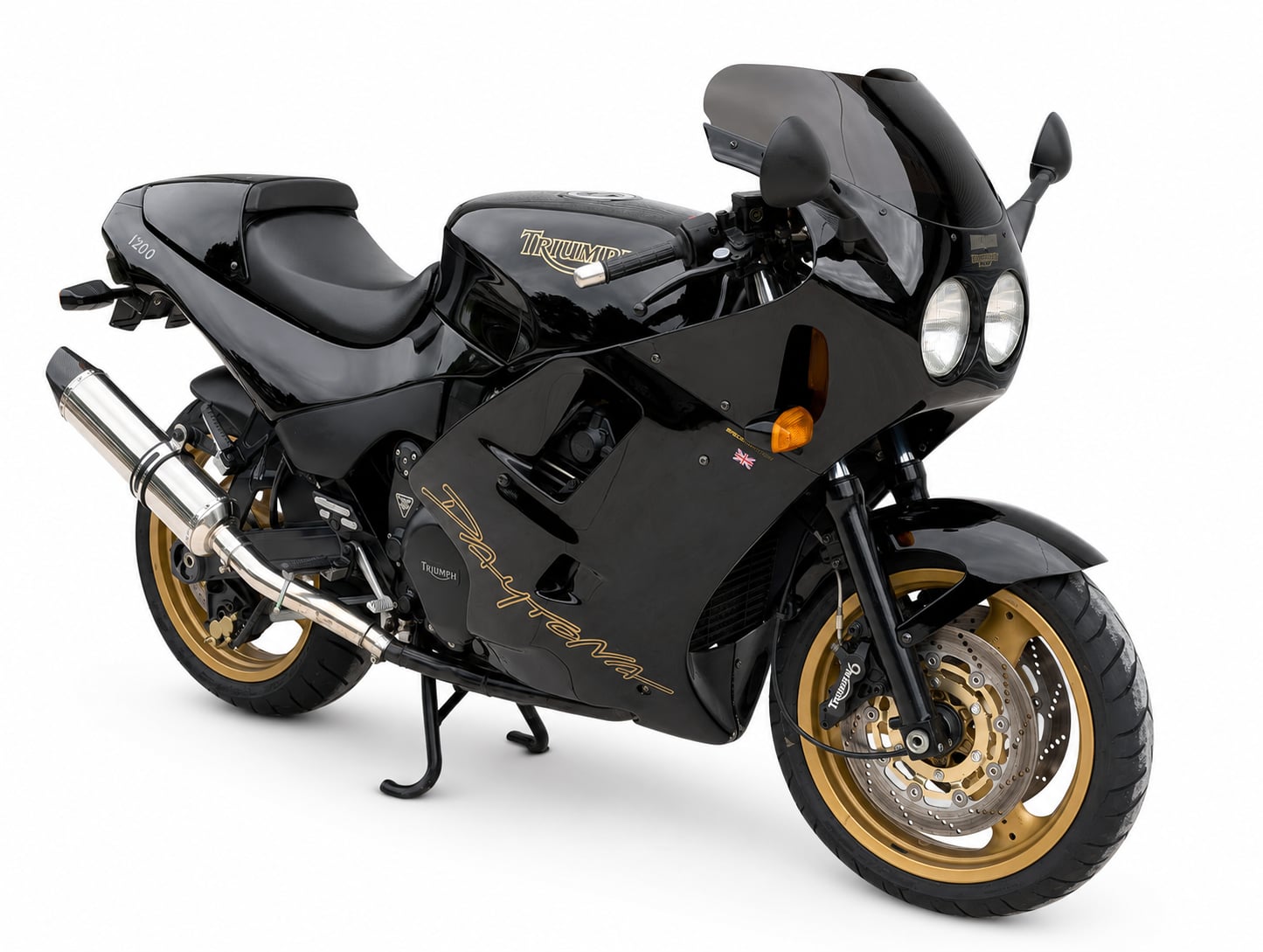 Triumph Daytona Model History and Buyer’s Guide (1967-2026) 8 Black and gold 1998 Triumph Daytona 1200 SE in a studio