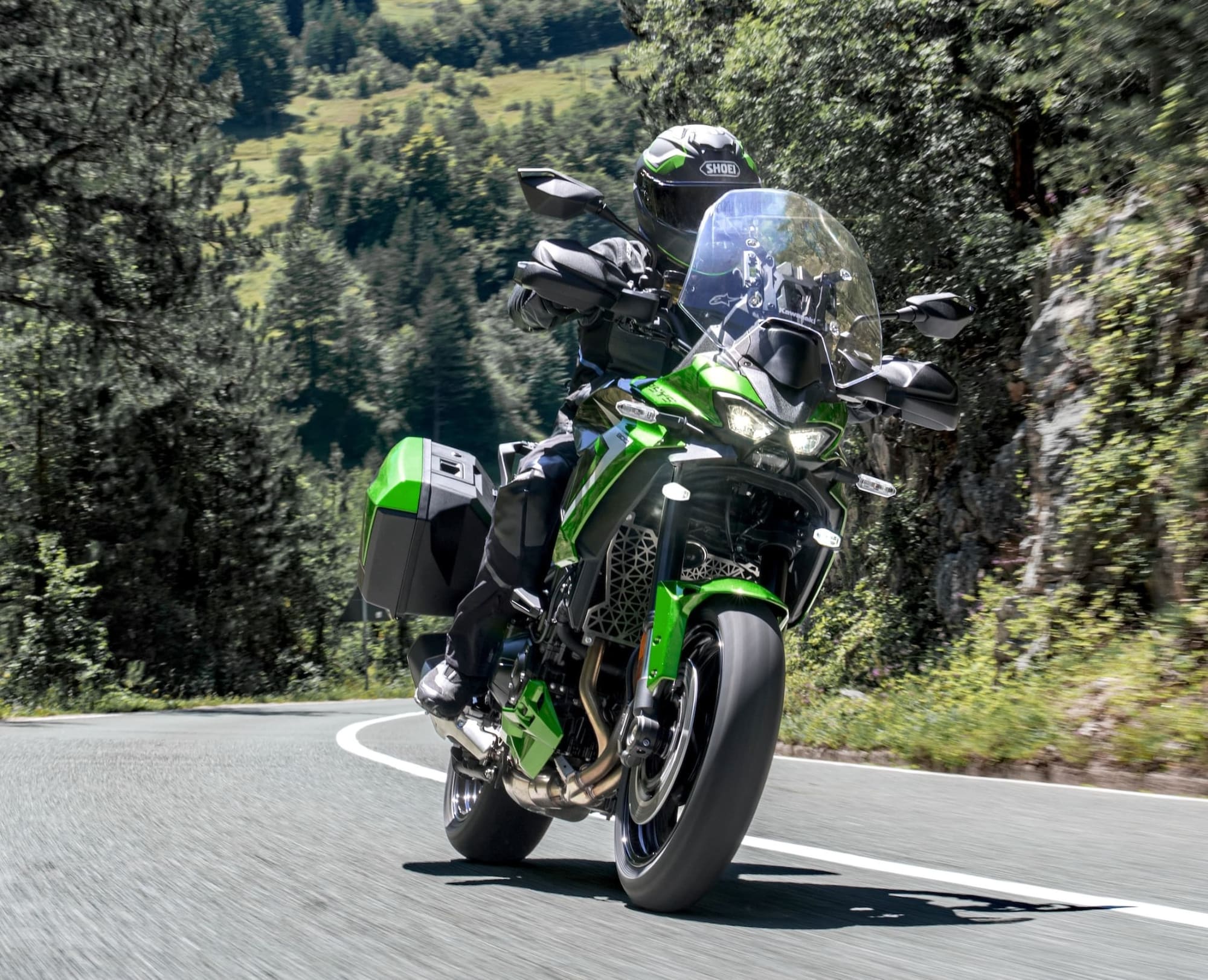 2027 Kawasaki Versys 900 — Radar Cruise Comes to the Middleweights 1 2027 Kawasaki Versys 900 SE ridden on winding mountain road