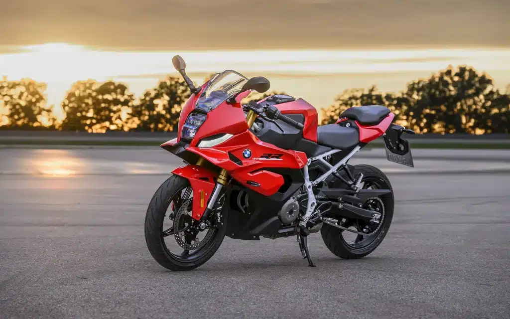 BMW 450 Motorcycles Buyers Guide 1 BMW F 450 RR Sport in Racing Red, parked at a racetrack at sunset