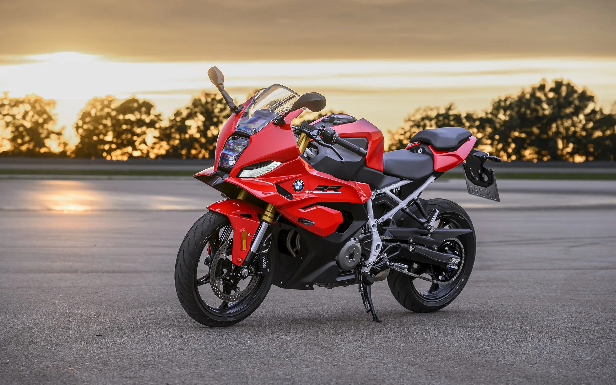 BMW 450 Motorcycles Buyers Guide 1 BMW F 450 RR Sport in Racing Red, parked at a racetrack at sunset